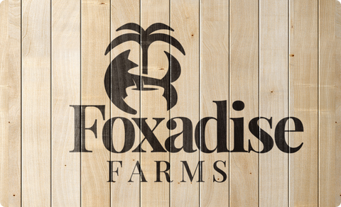 Foxadise Farms logo on wood panels