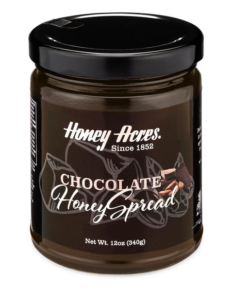 A jar of Clover Honey with the label 'Honey Acres - Chocolate Honey Spread' and a floral design.