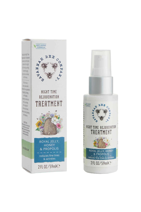 A bottle of Royal Jelly Night Time Rejuvenation Treatment next to its packaging box. The bottle is spray-shaped with a white pump and a label featuring an image of a bee and flowers.