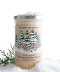 Savannah Bee Company winter white honey jar with snowy landscape label on a white background