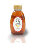 Bottle of Holly Honey with a wooden cap on a white background
