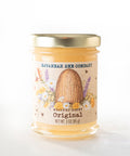 Jar of Savannah Bee Company honey on a white background.
