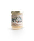 Jar of Savannah Bee Company winter white honey on a white background