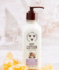 Body lotion bottle with honeycomb and honey on a textured background