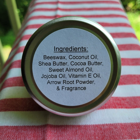 Jar lid with ingredient list on a red and white striped fabric background