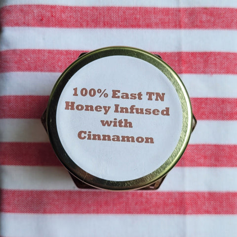 Honey container lid with text on a red and white striped background