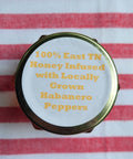 


Habanero pepper jar with text on a red and white striped background