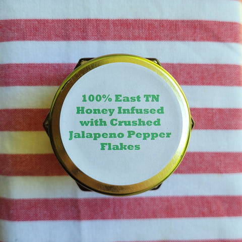 Honey container lid with text on a striped fabric background