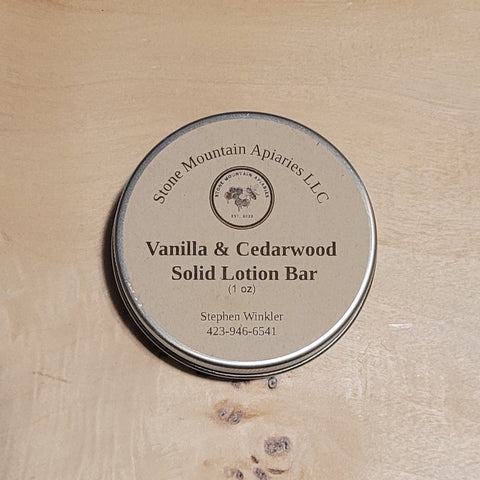 Vanilla & Cedarwood Solid Lotion Bar by Stone Mountain Apiaries LLC on a wooden surface