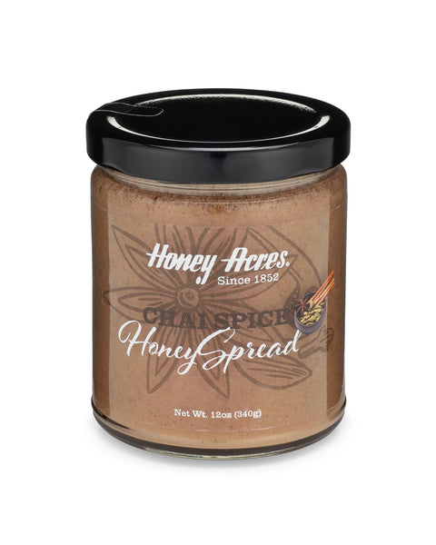 A jar of Honey-Here's Honey Spread with the label facing forward. The label indicates that the product is honey spread, with no visible flavor specific.