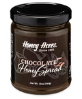 A jar of Clover Honey with the label 'Honey Acres - Chocolate Honey Spread' and a floral design.