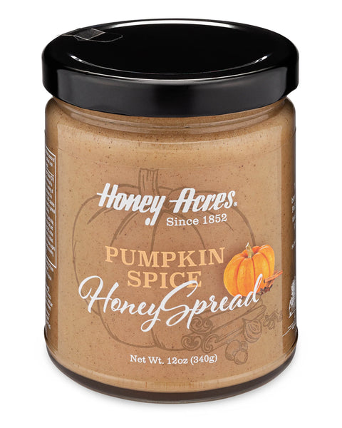 A jar of Clover Honey with the label 'Honey Acres - Pumpkin Spice Honey Spread' and a floral design.