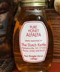 A jar of pure honey alfalfa with a label indicating it is made especially for The Dutch Kettle, Hamptonsville, NC. The net weight is 16 oz (454g).