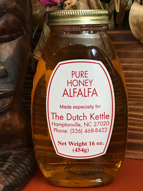 A jar of pure honey alfalfa with a label indicating it is made especially for The Dutch Kettle, Hamptonsville, NC. The net weight is 16 oz (454g).