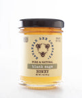A jar of Black Sage Honey with a label indicating it is pure & natural, made in USA.