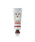 A tube of Beeswax Handcream with Honey Almond fragrance, packaging displays the brand's logo and product information.