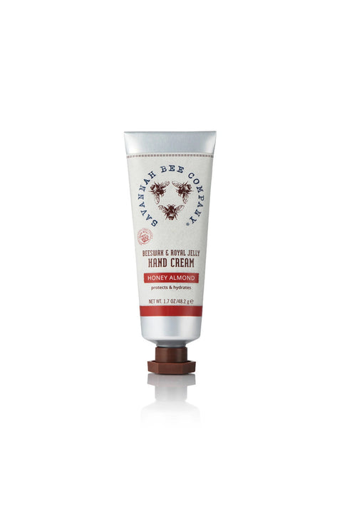A tube of Beeswax Handcream with Honey Almond fragrance, packaging displays the brand's logo and product information.