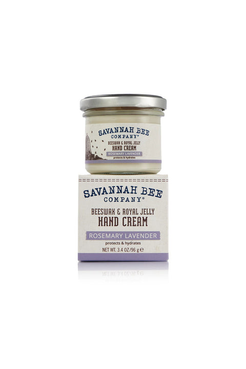 A jar of Savannah Bee Company's Rosemary Lavender Beeswax Handcream with a white label featuring those words and an image of bees.