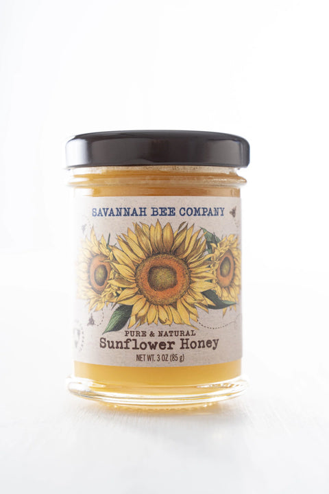 A jar of Savannah Bee Company Sunflower Honey with a label featuring a sunflower design.